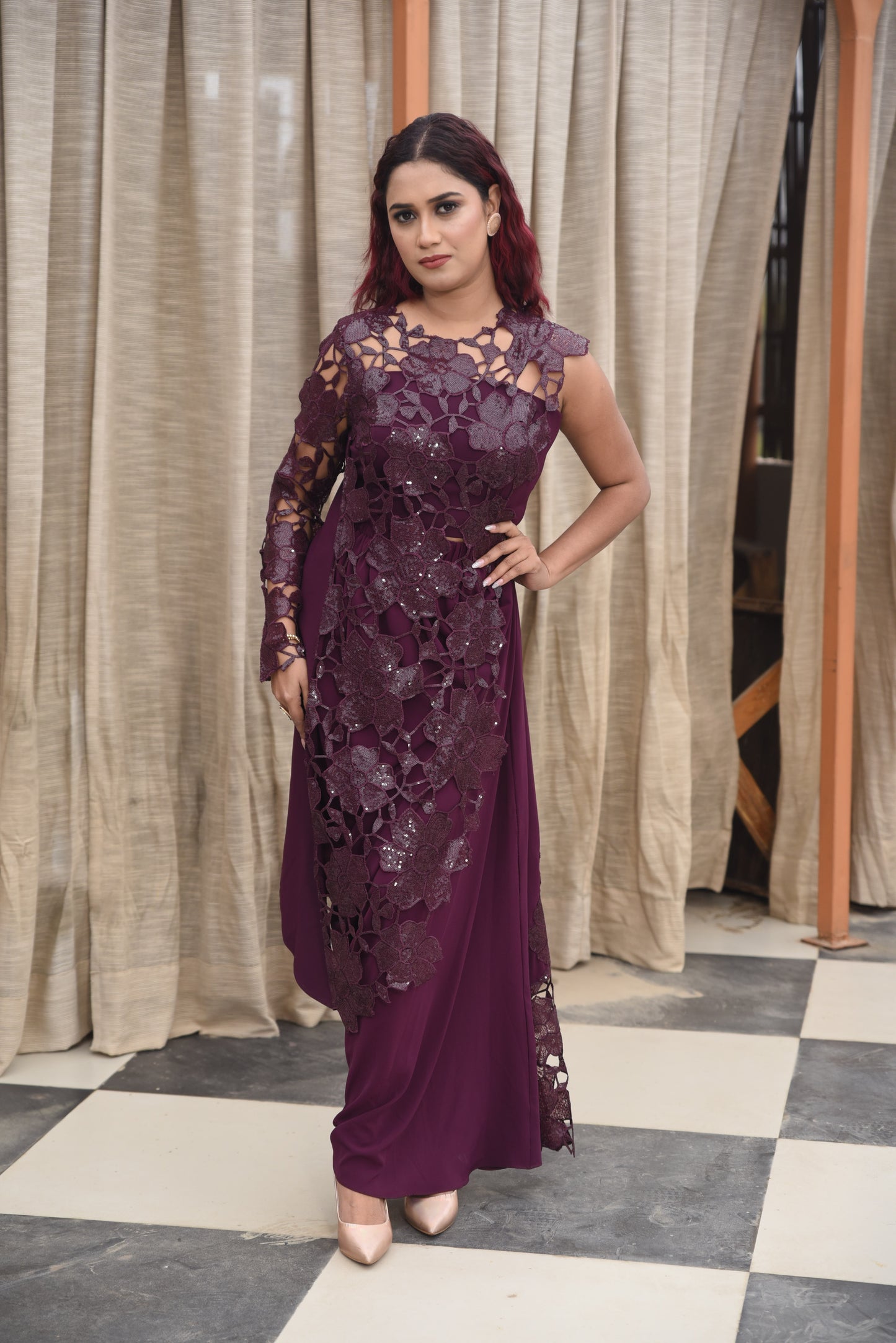 Deep plum asymmetrical gown adorned with a 3D floral lace overlay on one side, creating a dramatic and elegant look