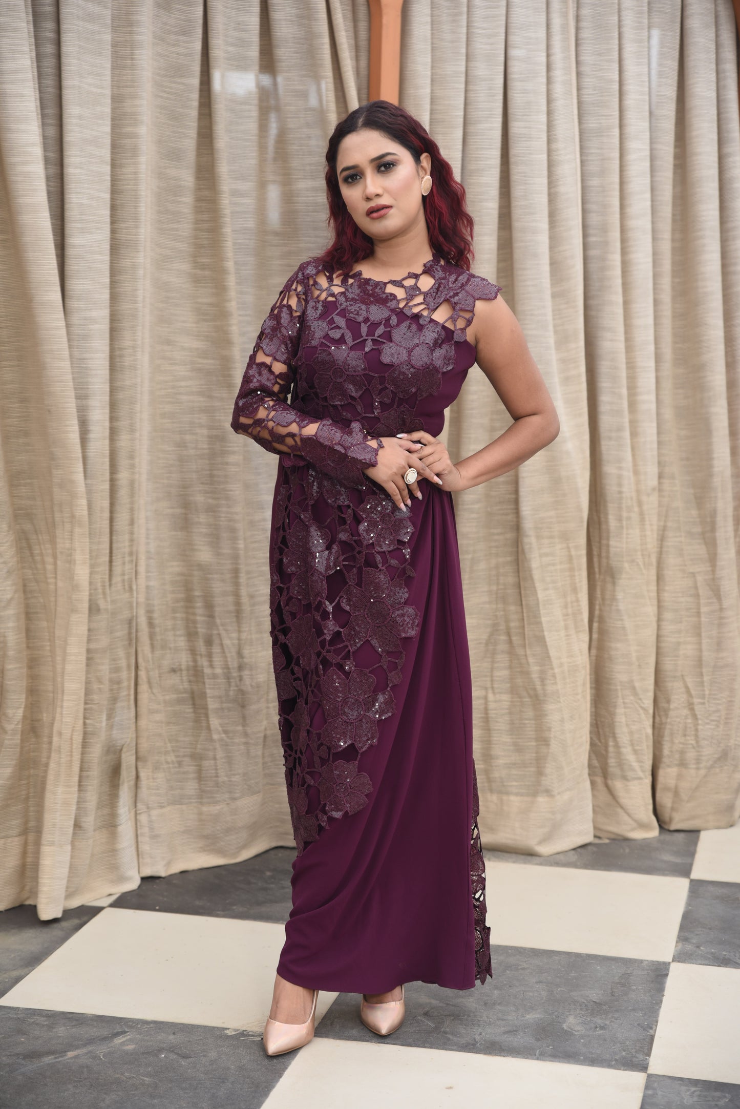 Deep plum asymmetrical gown adorned with a 3D floral lace overlay on one side, creating a dramatic and elegant look